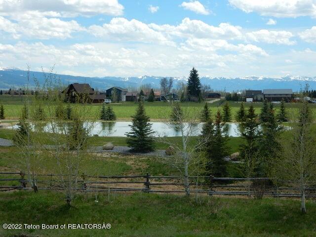 water view with a mountain view and a rural view