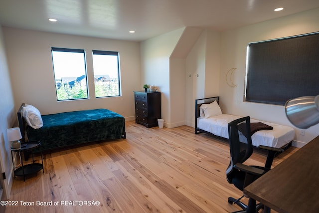 bedroom with light hardwood / wood-style flooring