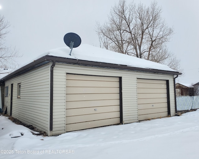 view of snow covered garage