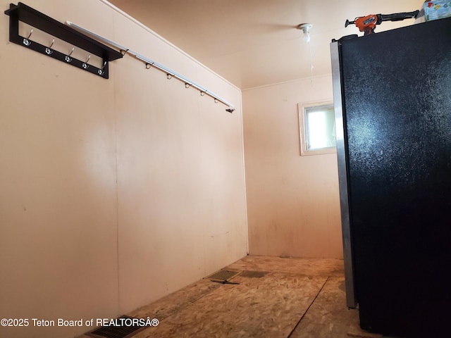 basement with fridge