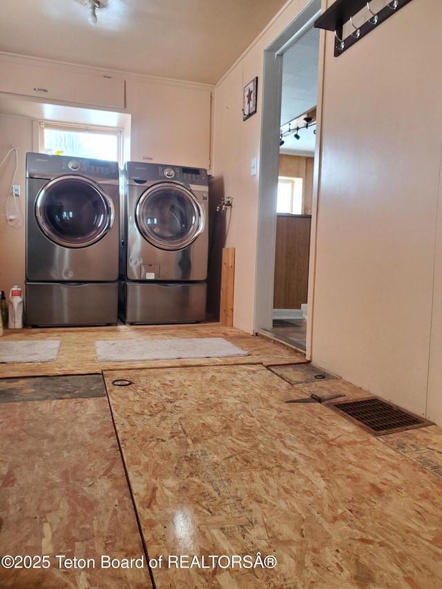 washroom with washing machine and dryer