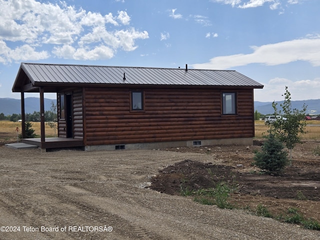 view of home's exterior with a mountain view