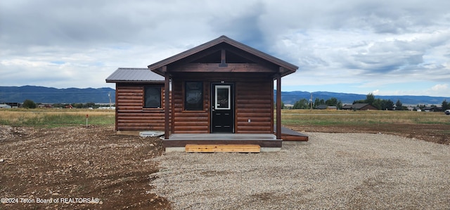 log home featuring a mountain view