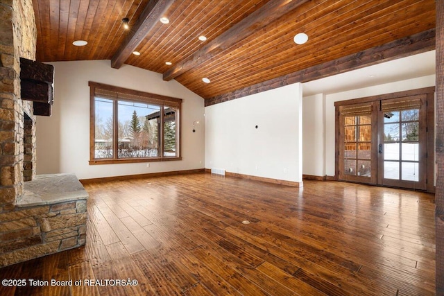 unfurnished living room with french doors, wooden ceiling, lofted ceiling with beams, wood-type flooring, and a fireplace