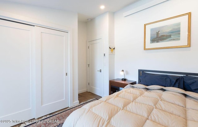 1875 W Cinnamon Teal Rd, Jackson, WY 83001 - bedroom featuring a closet, wood finished floors, recessed lighting, and baseboards