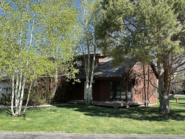 1875 W Cinnamon Teal Rd, Jackson, WY 83001 - view of front of property with a front lawn