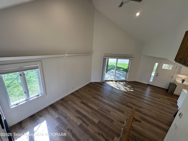 1875 W Cinnamon Teal Rd, Jackson, WY 83001 - unfurnished living room with high vaulted ceiling, wood finished floors, baseboards, and ceiling fan