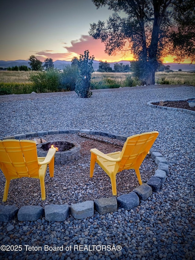 view of property's community with an outdoor fire pit