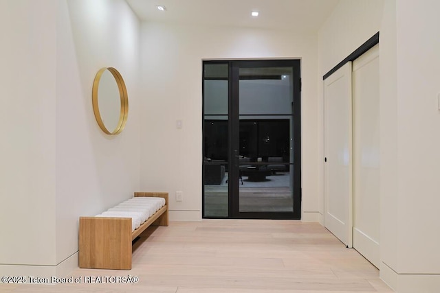 corridor featuring light hardwood / wood-style flooring