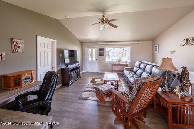 living room featuring ceiling fan, dark wood-type flooring, and lofted ceiling