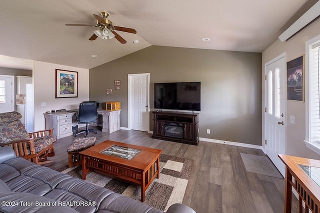 living room featuring lofted ceiling, ceiling fan, and dark wood-type flooring