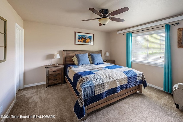 bedroom with light colored carpet and ceiling fan