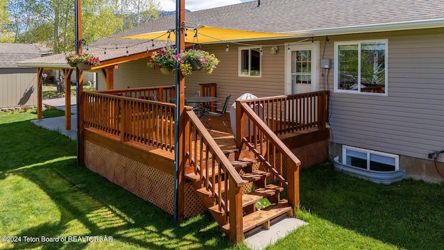 wooden terrace featuring a yard