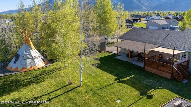 birds eye view of property with a mountain view