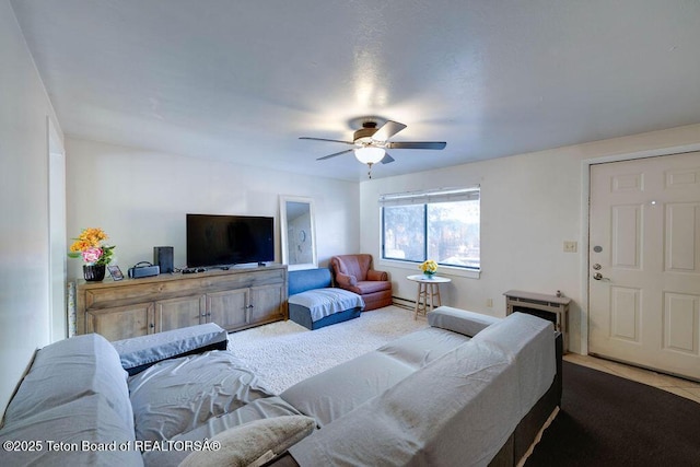 living room with carpet flooring and ceiling fan