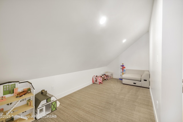 game room featuring light colored carpet and lofted ceiling