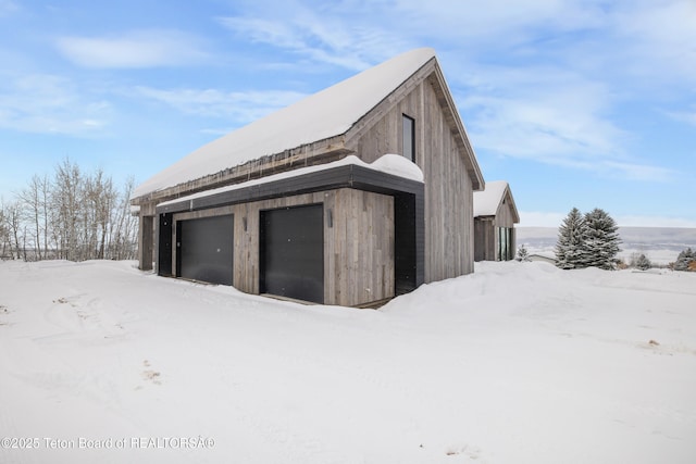 view of snow covered garage