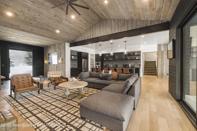 living room with ceiling fan, light hardwood / wood-style flooring, wooden ceiling, and vaulted ceiling