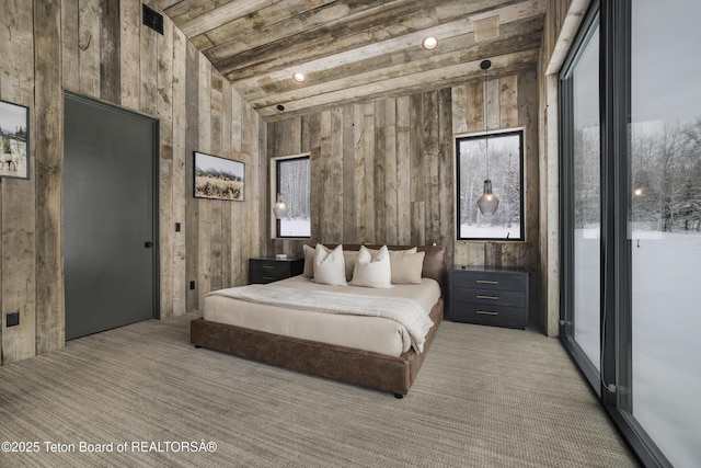 bedroom with lofted ceiling with beams and wood ceiling