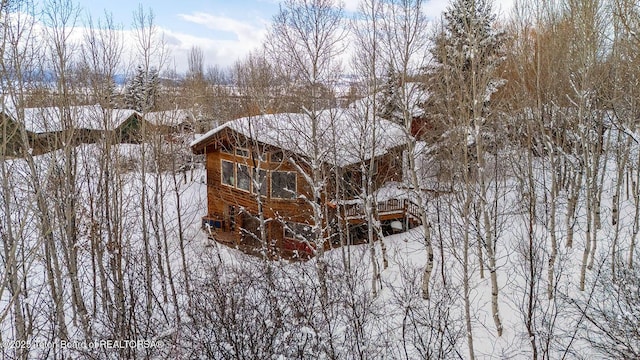 view of snow covered property