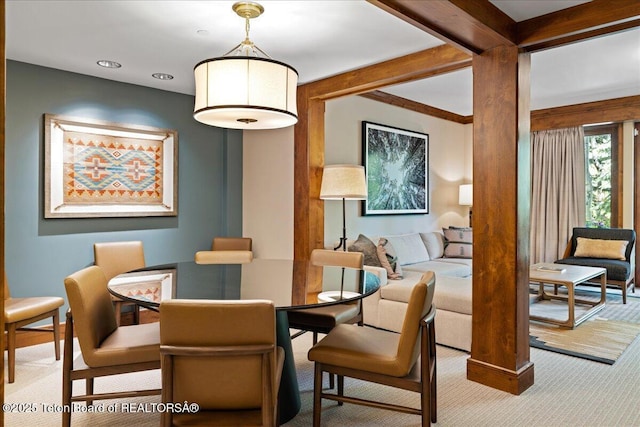 dining room with light colored carpet