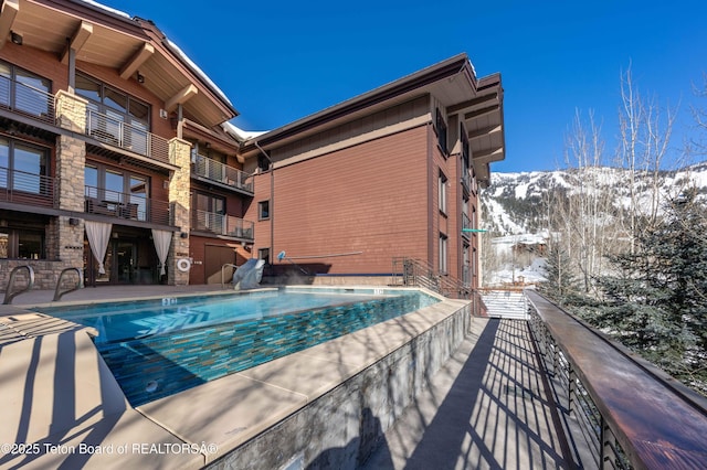 view of snow covered pool