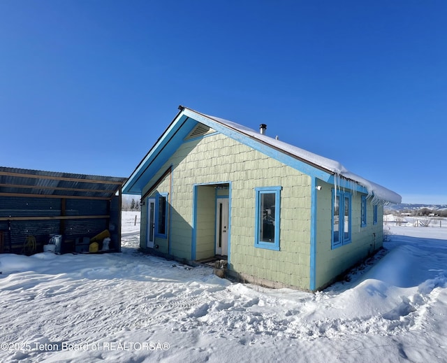 view of snow covered house