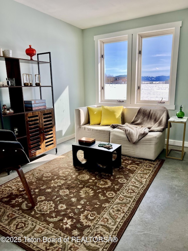 living room featuring baseboards