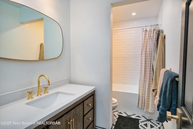 full bathroom featuring toilet, vanity, tile patterned floors, and shower / bath combo