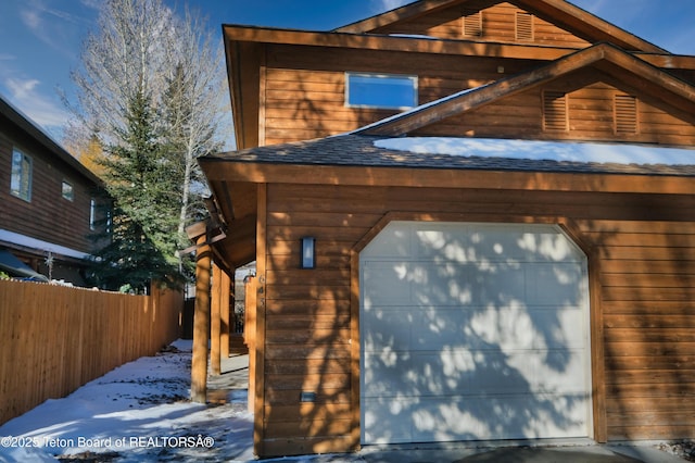 view of snow covered garage