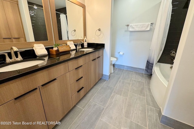 full bathroom featuring shower / bathtub combination with curtain, vanity, and toilet