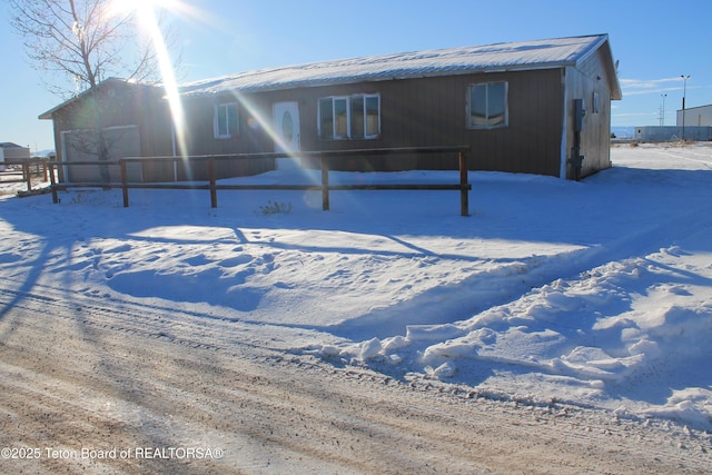 view of snow covered property