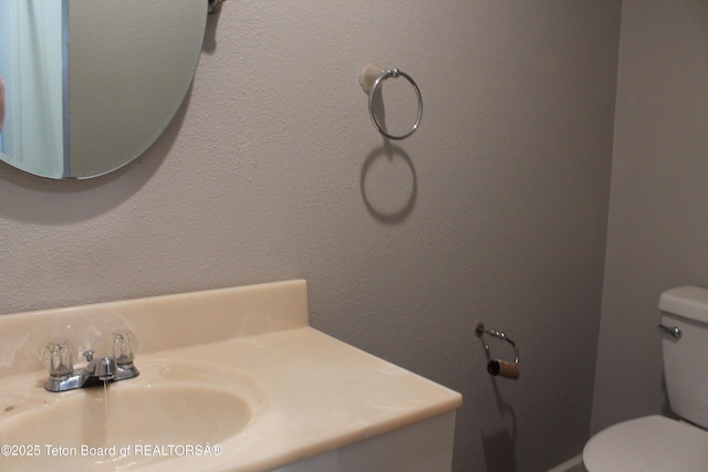 bathroom featuring sink and toilet