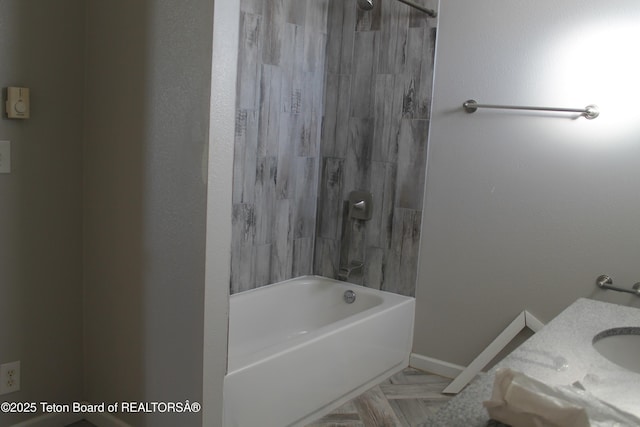 bathroom featuring bathing tub / shower combination and vanity