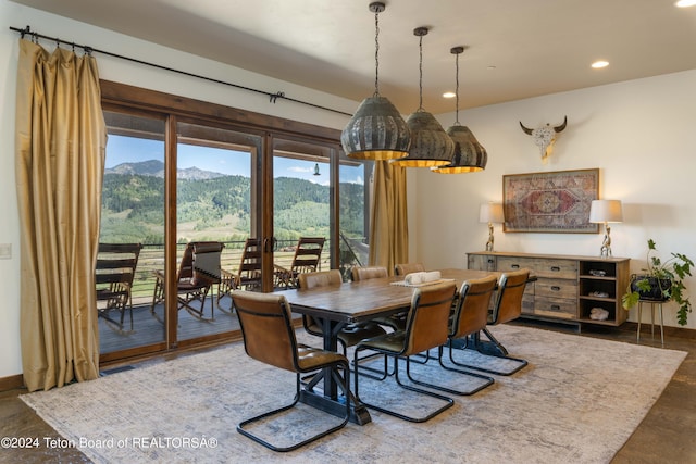 dining room featuring a mountain view