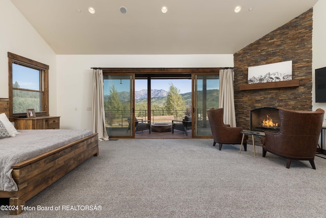 bedroom with carpet floors, a fireplace, access to outside, and vaulted ceiling