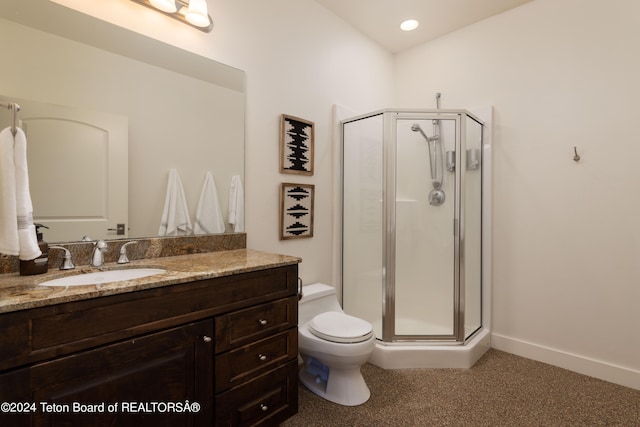 bathroom featuring vanity, toilet, and walk in shower