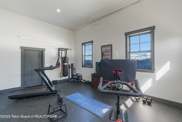 workout room featuring recessed lighting and baseboards