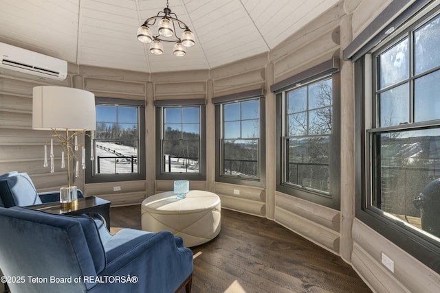 interior space featuring plenty of natural light, a chandelier, and a wall mounted AC