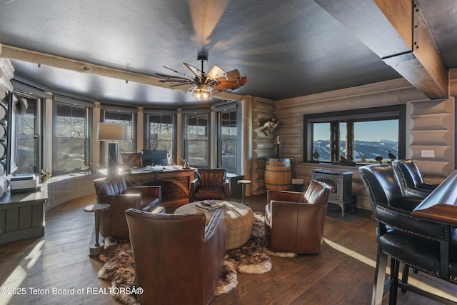 home office featuring log walls and hardwood / wood-style floors