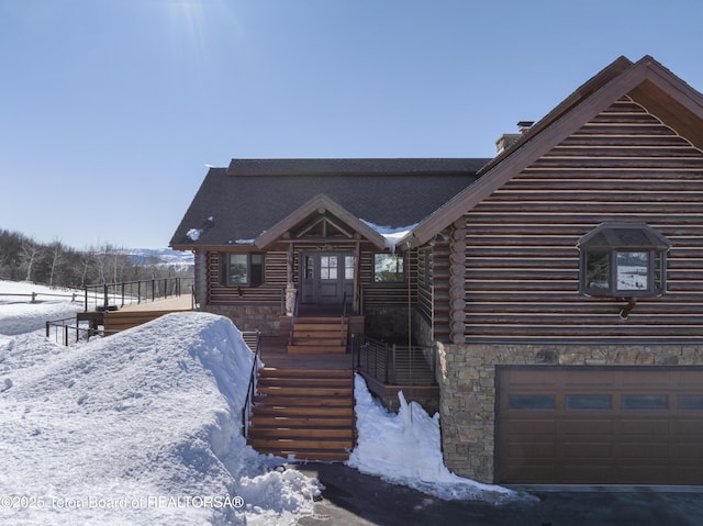 log home featuring log exterior