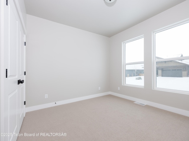 view of carpeted spare room