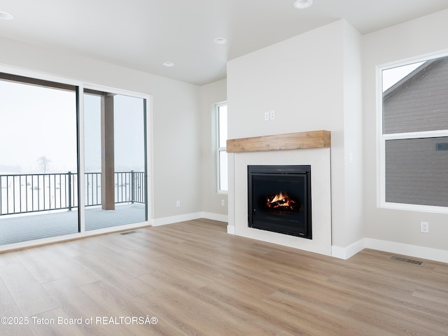 unfurnished living room with light wood-type flooring