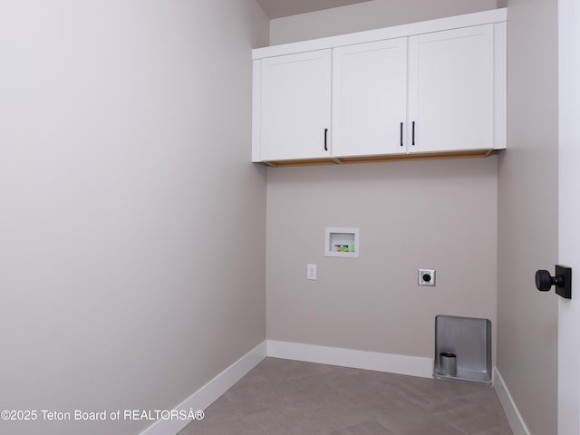 clothes washing area with washer hookup, cabinets, light tile patterned floors, and hookup for an electric dryer