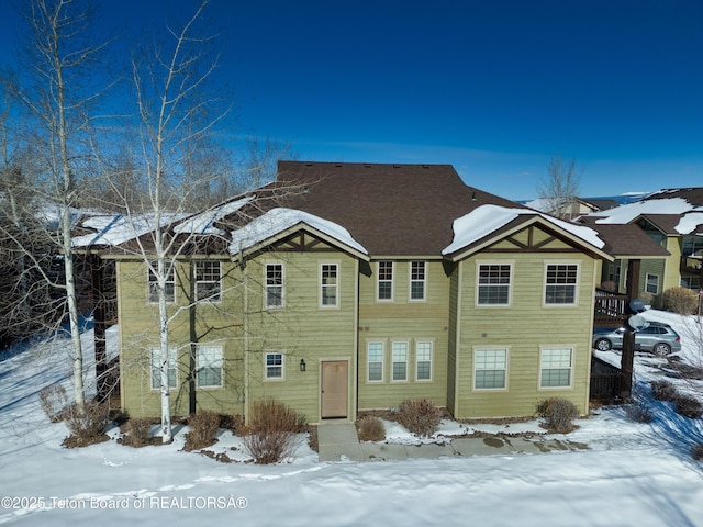 view of snow covered house