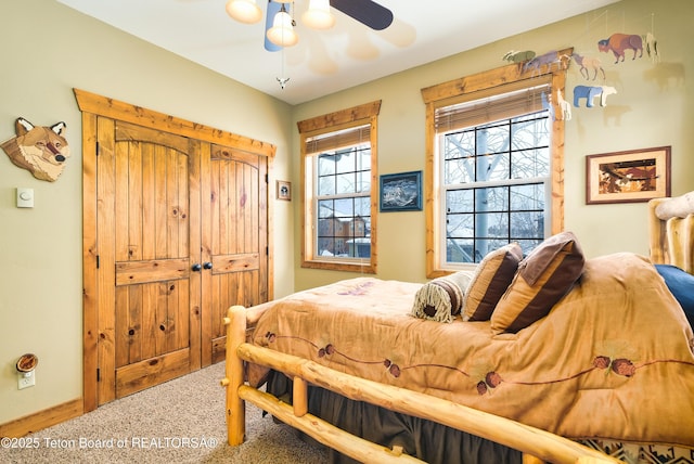 carpeted bedroom featuring ceiling fan