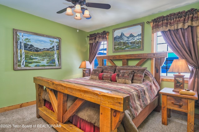 bedroom featuring ceiling fan and light colored carpet