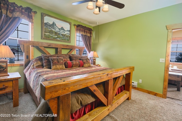 bedroom featuring light carpet and ceiling fan