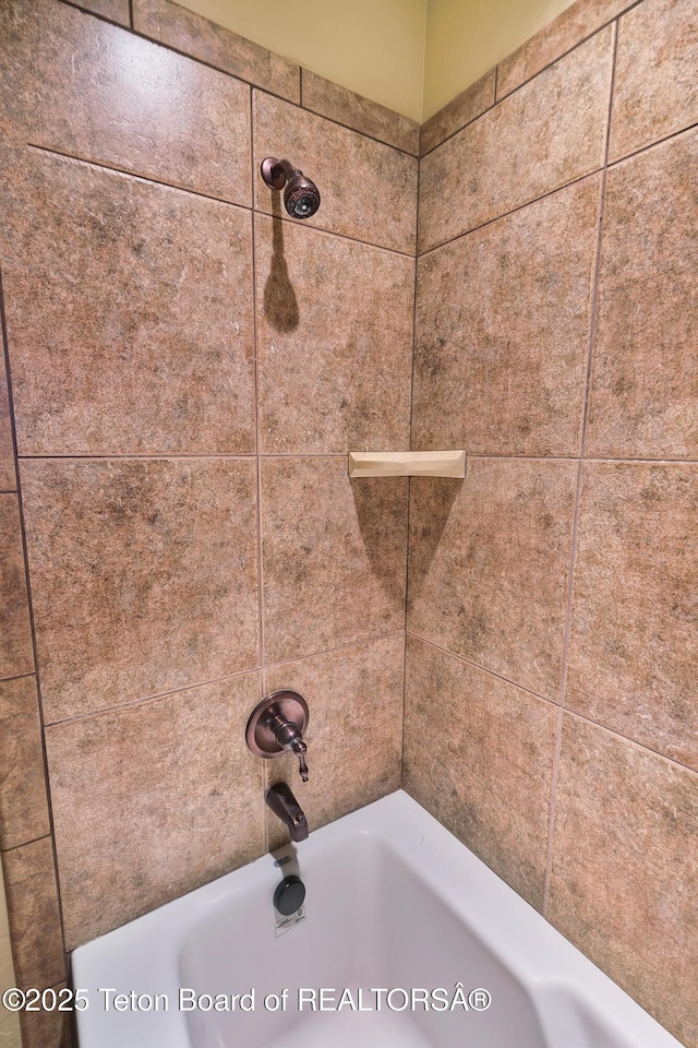 interior details with tiled shower / bath