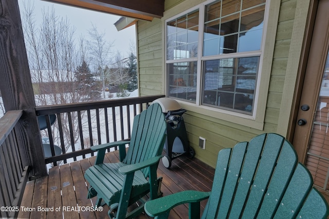 view of snow covered deck